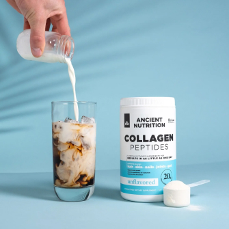 collagen peptides bottle next to glass of iced coffee with oat milk