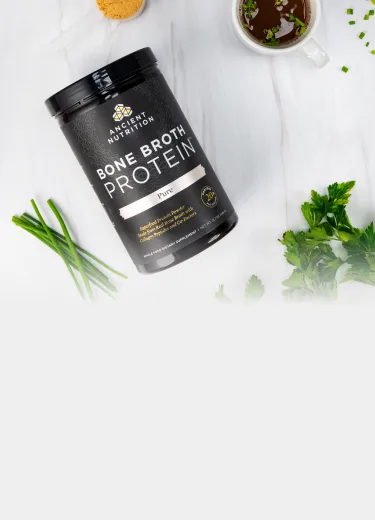 bone broth protein pure next to cup of bone broth