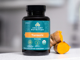 Bottle of Organic Turmeric Capsules with turmeric root