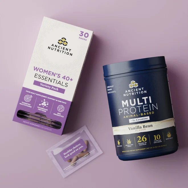 Women's 40+ essentials variety pack and a bottle of multi protein powder on a purple background