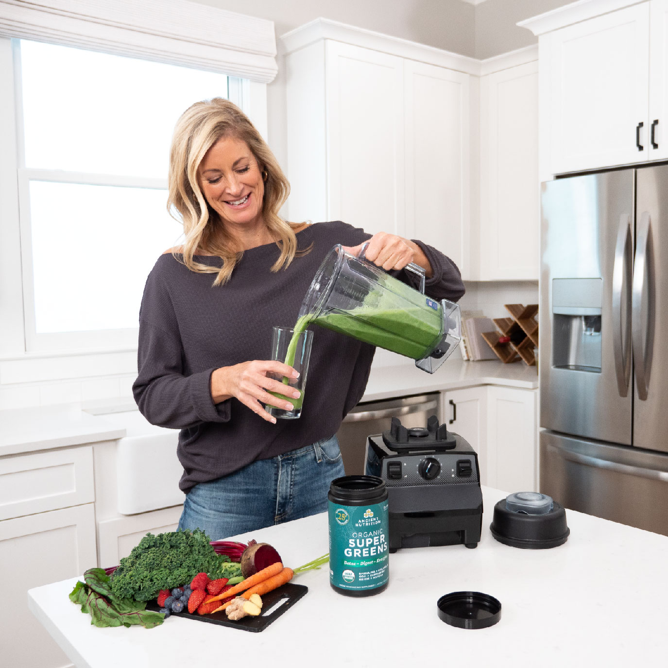 a woman making a smoothie