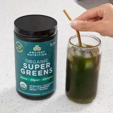 supergreens getting mixed in a glass