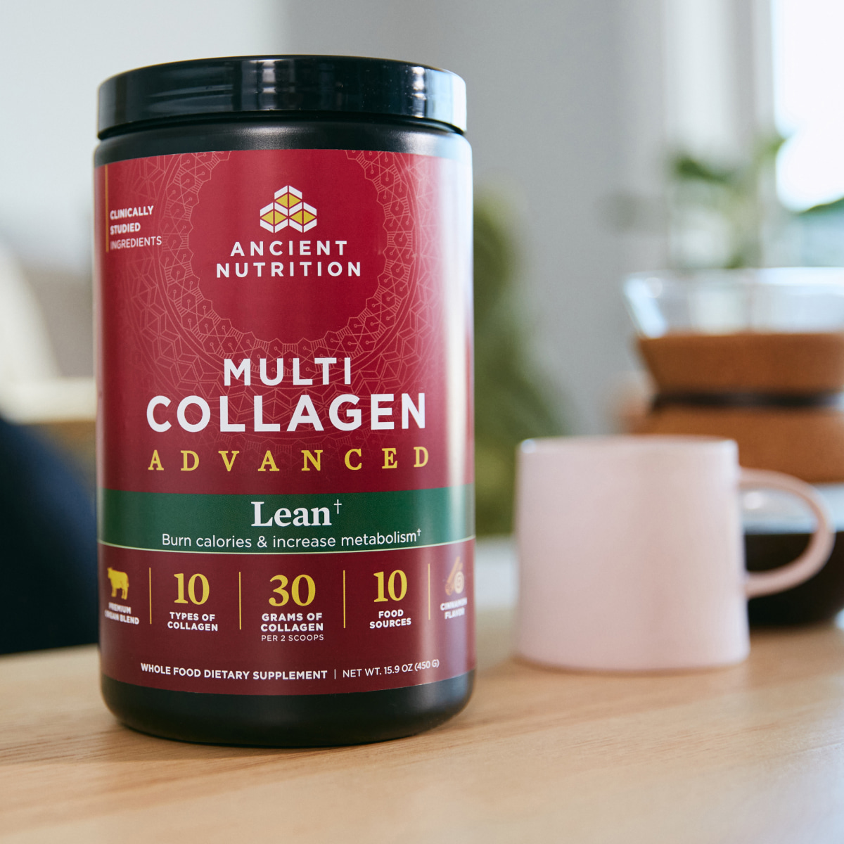 multi collagen advanced lean powder next to a coffee cup