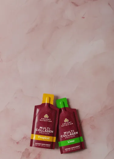 multi collagen protein gel packs on a marbled background
