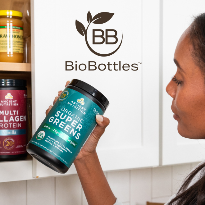A woman taking out a bottle of Organic SuperGreens from a cabinet with the BioBottle logo overlaid