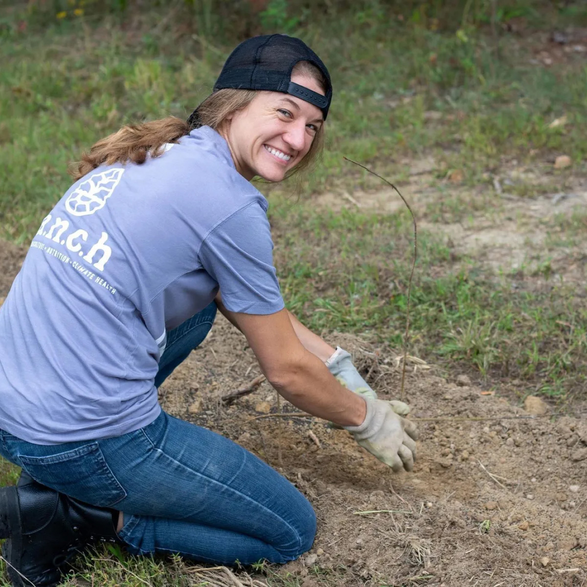 employee on the RANCH planting trees