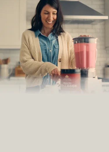 woman making a smoothie