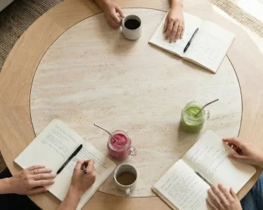 wood table with notebooks