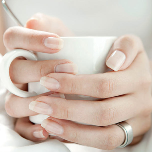 person holding a coffee cup