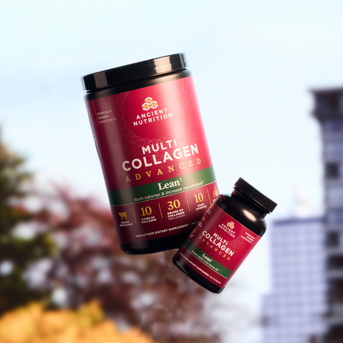 bottles of multi collagen advanced lean powder and capsules in the air