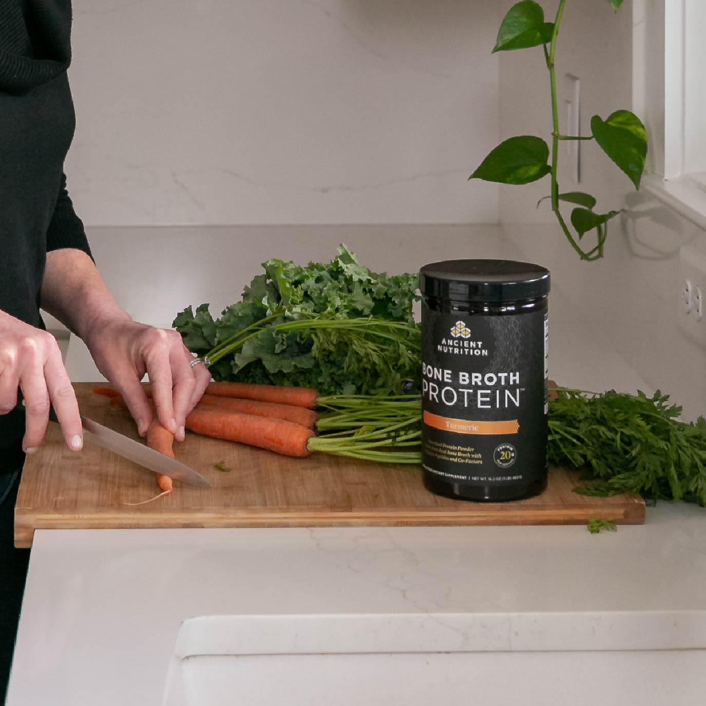 Bone broth protein powder turmeric on a kitchen counter 