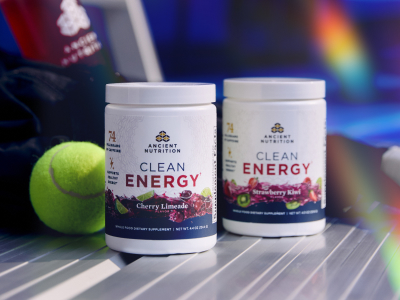 2 bottles of clean energy on a tennis court