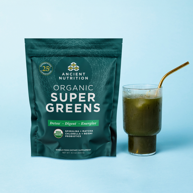 supergreens bag next to a glass of greens