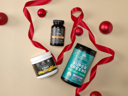 Supergreens, fiber, and sbo probiotics on tan holiday background