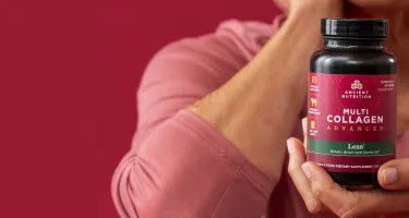 a person holding a bottle of multi collagen advanced lean capsules