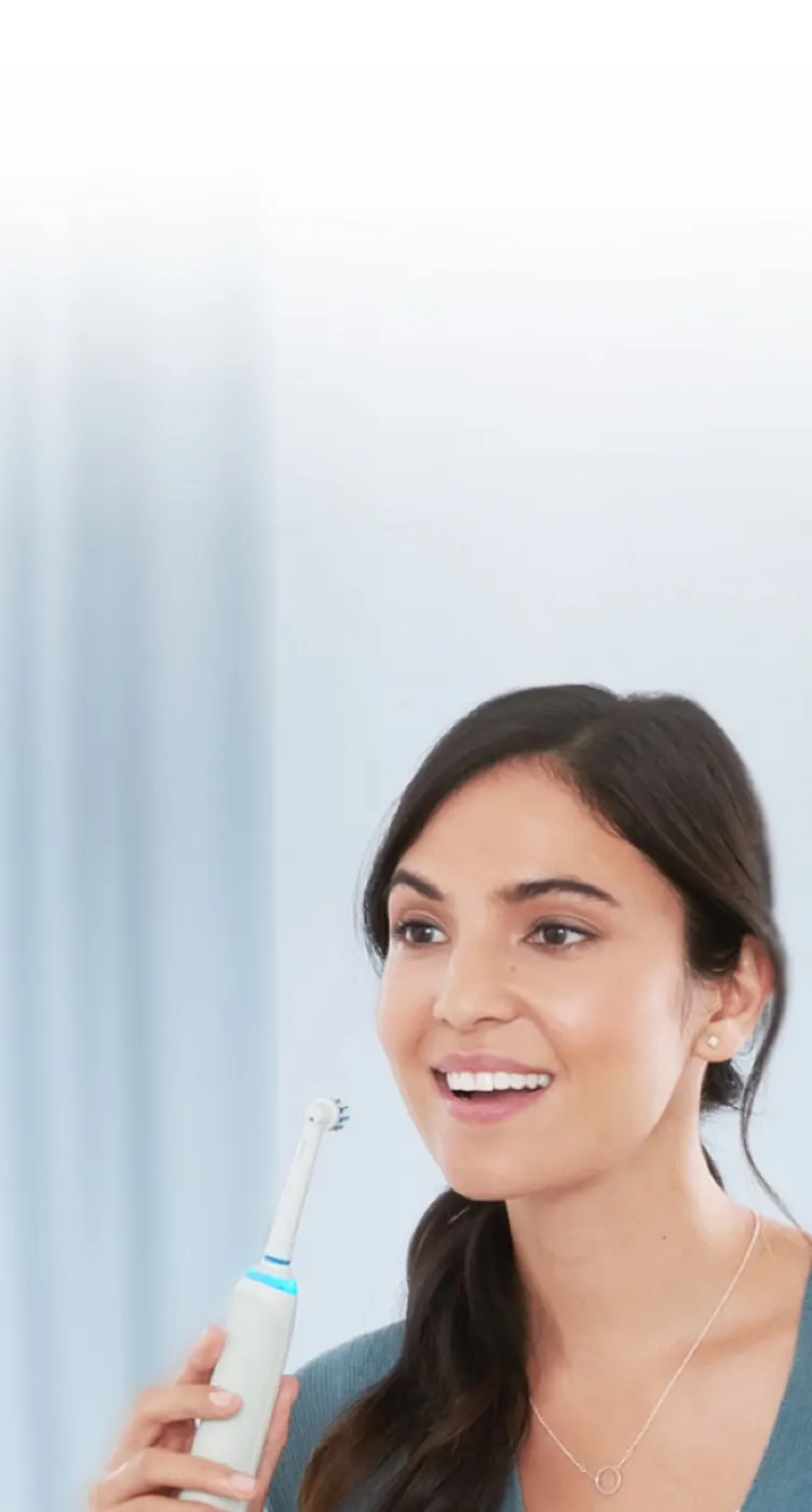 Lady with electric toothbrush product