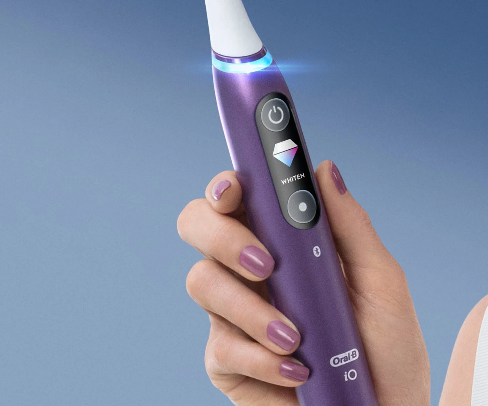 Close-up of iO Series 8 electric toothbrush LCD display and pressure sensor 