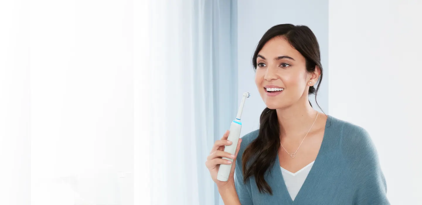 Lady with electric toothbrush product