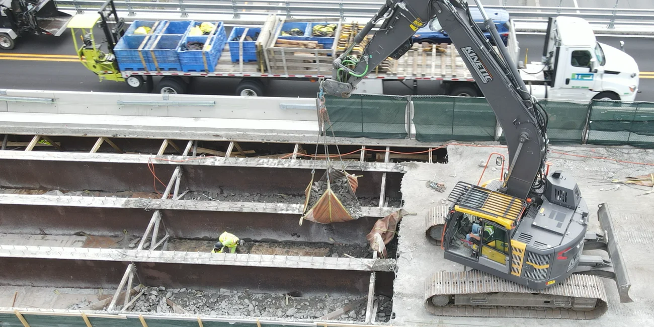 Workers wearing safety equipment on a Kinetic Demolition site.