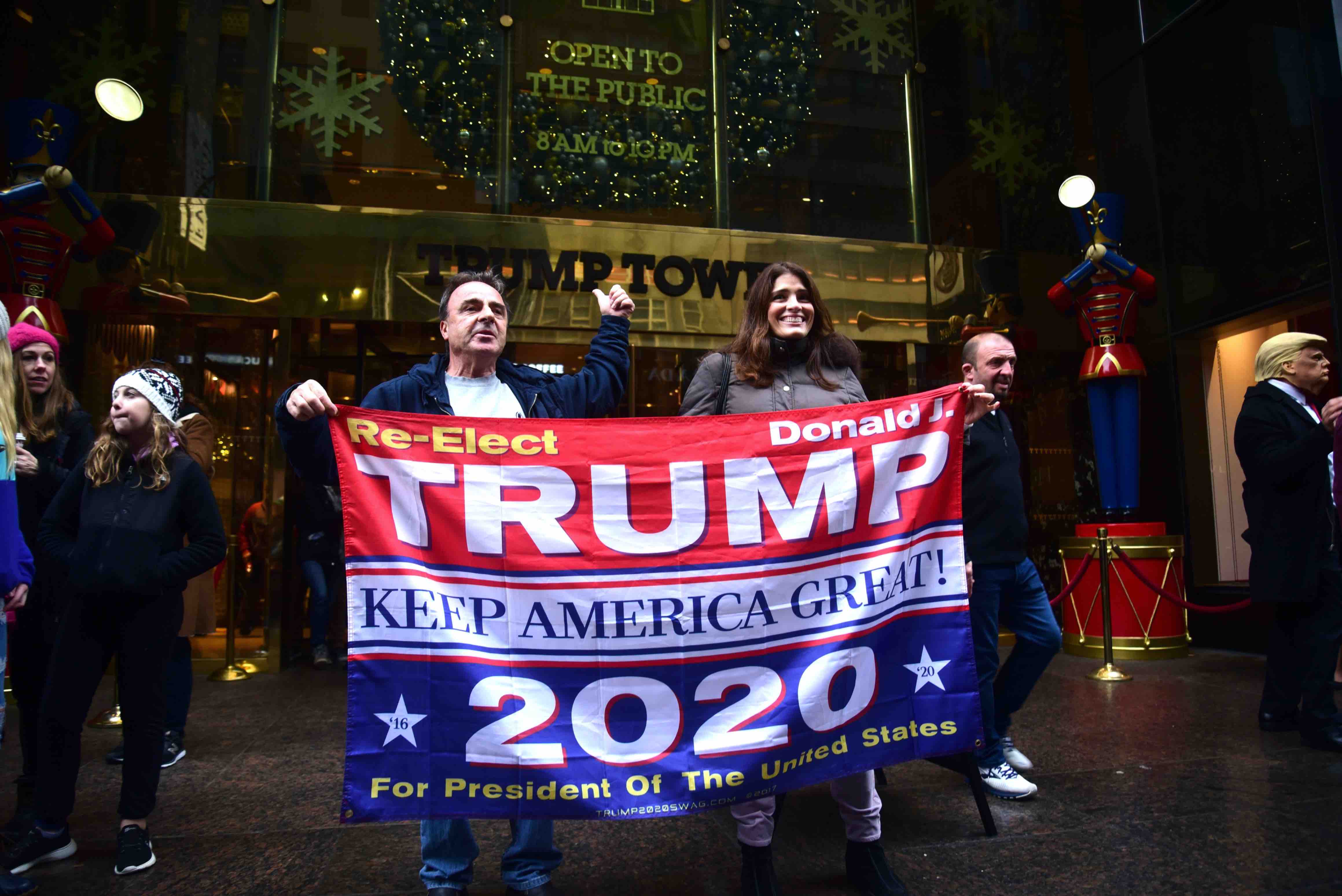 NEW YORK, NEW YORK-DECEMBER 2019- Trump supporters hold a banner in front of Trump Tower in Manhattan, supporting the president for re-election in 2020 - PC-Joe Tabacca