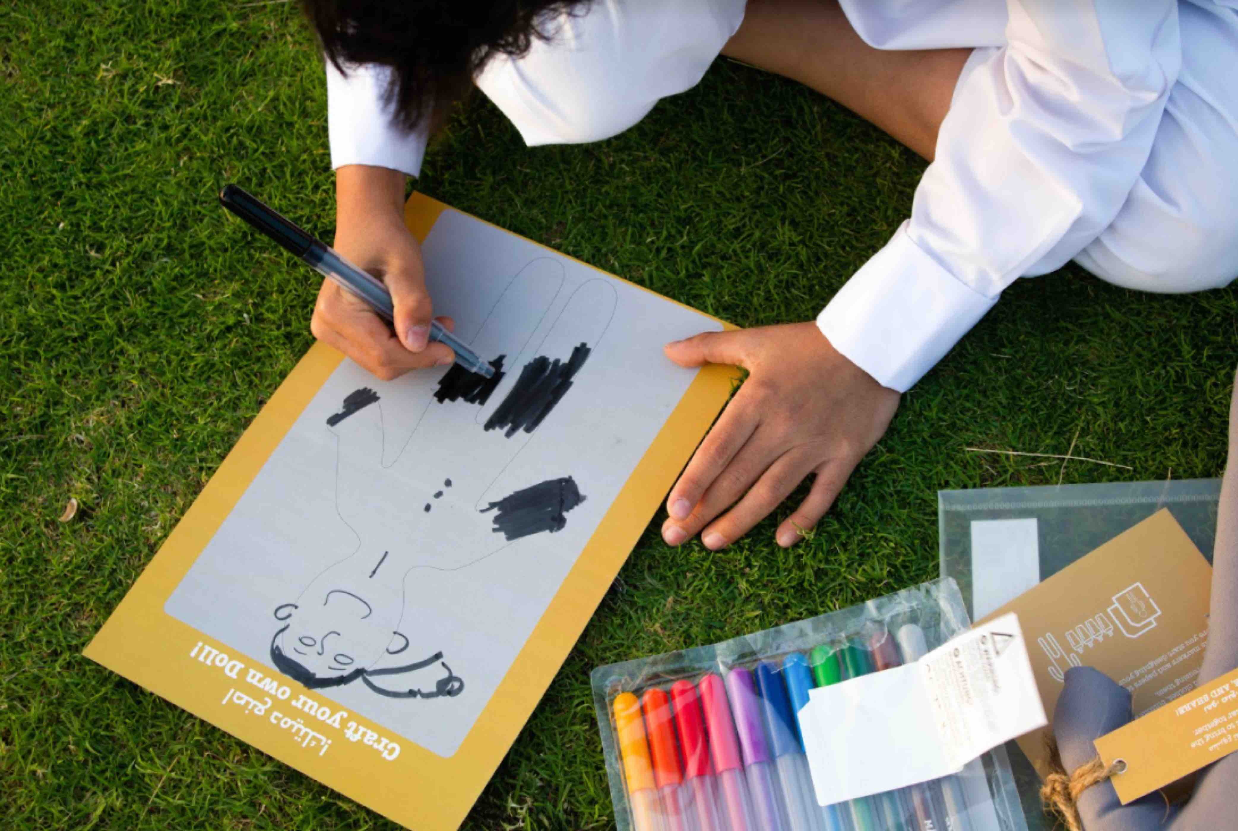 Al Muftah’s doll kit ‘Dream’ teaches allows children to create their own designs on the doll, and express their goals and aspirations - QF - 03