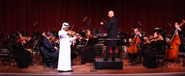 Two Qatar Foundation members collaborate on a musical evening
