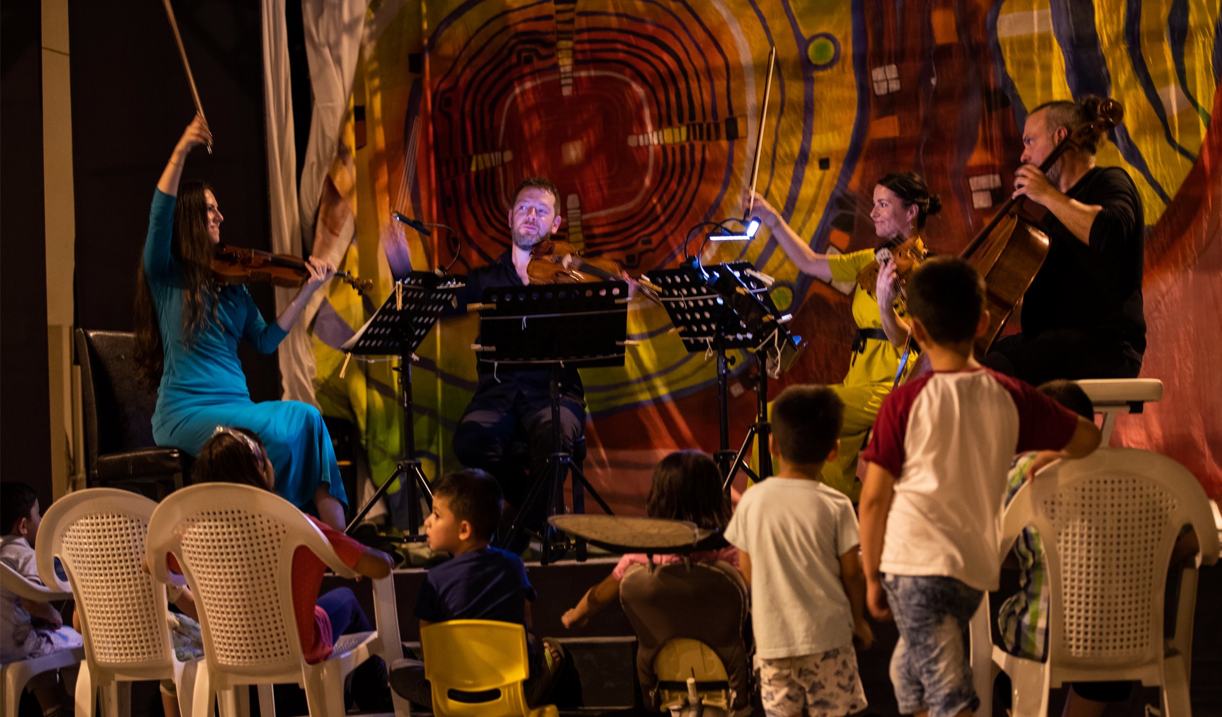 Musicians from Qatar Foundation present a musical evening for Afghan refugees in Doha - QF - 01