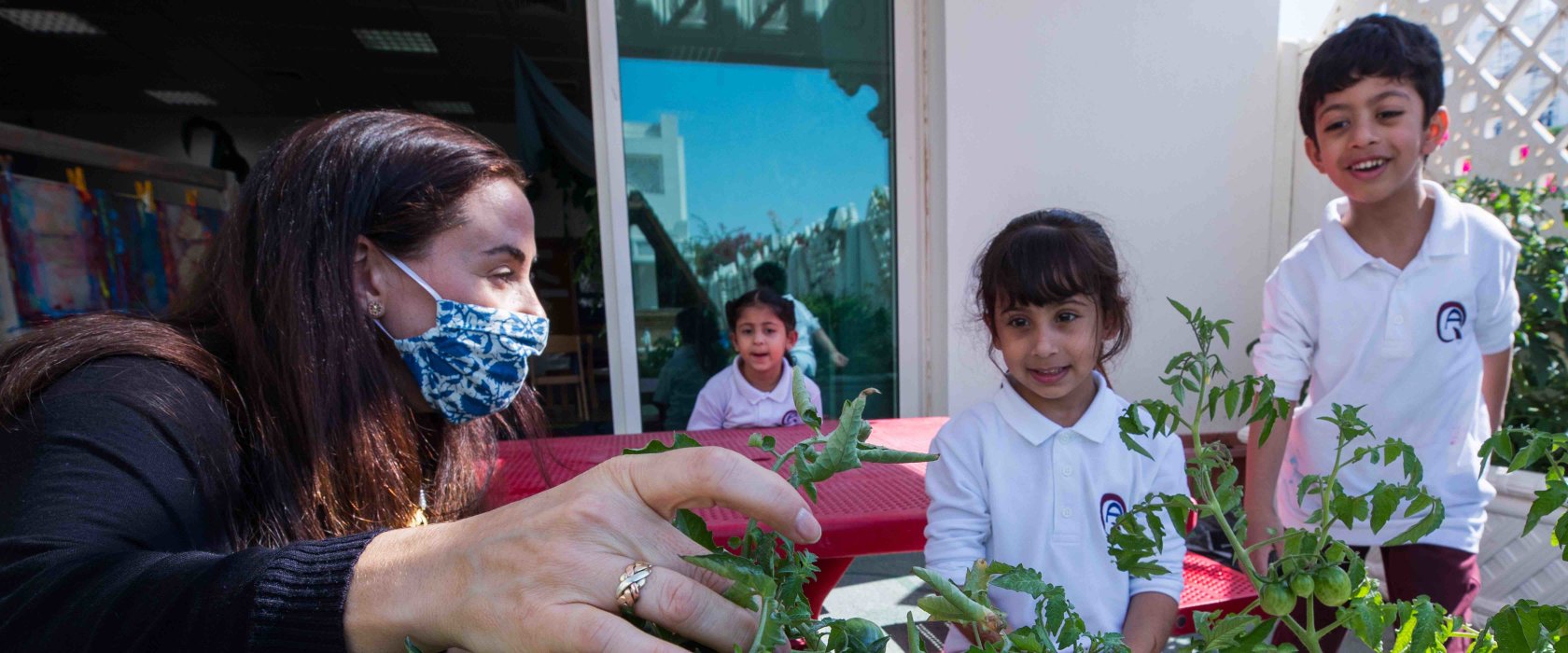 QF teachers helping students grow a green thumb