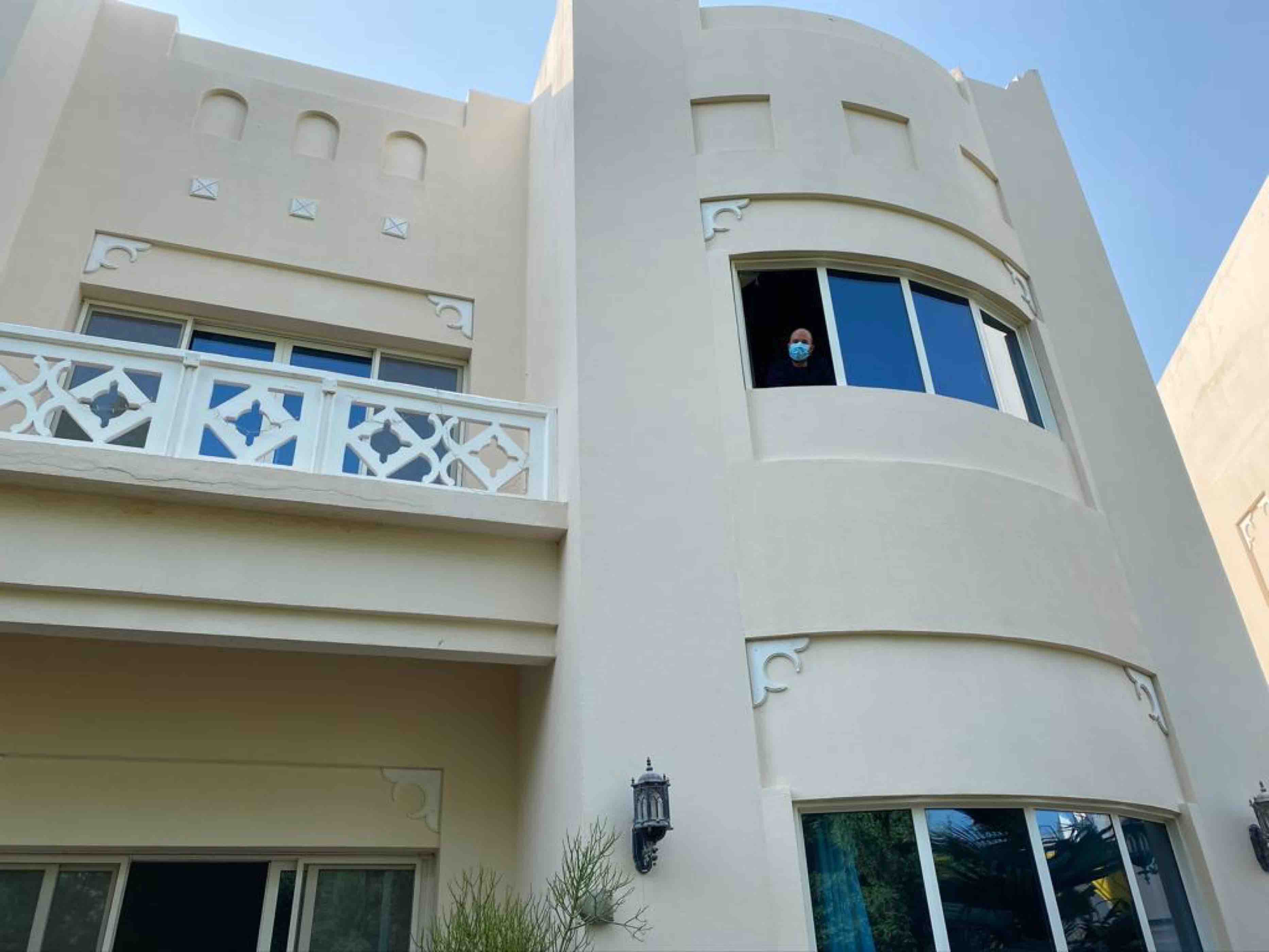 Mills practicing social distancing at home, interacting with his kids from a distance 3