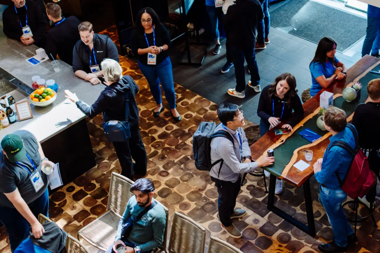 Conference attendees networking at the Juliet Cocktail Lounge Cybersecurity Event at the Venetian Hotel casino floor.