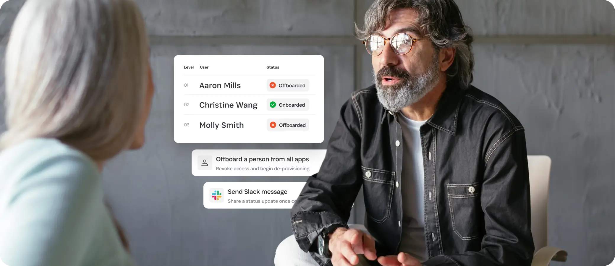 Two colleagues in conversation with an overlay showing a user list and onboarding/offboarding status actions, including an offboard workflow and Slack notification.