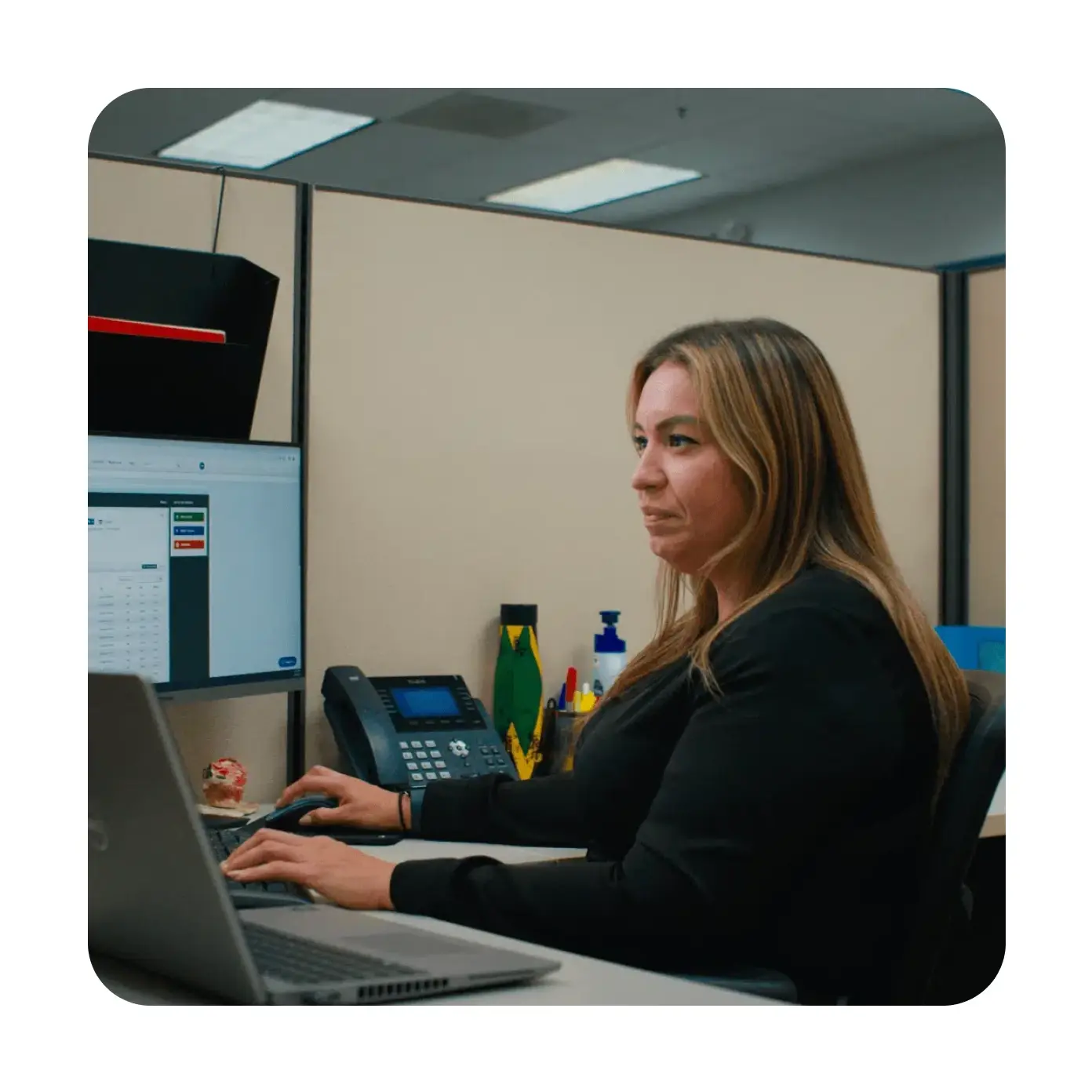 ServiceTrade employee at desk