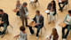 A standardized test proctor hands a test to a student sitting at a desk among rows of other students at desks in a large classroom