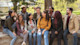 A group of international students sit outside on the campus of their Hispanic-Serving Institution (HSI) university in the US