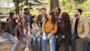 A group of international students sit outside on the campus of their Hispanic-Serving Institution (HSI) university in the US