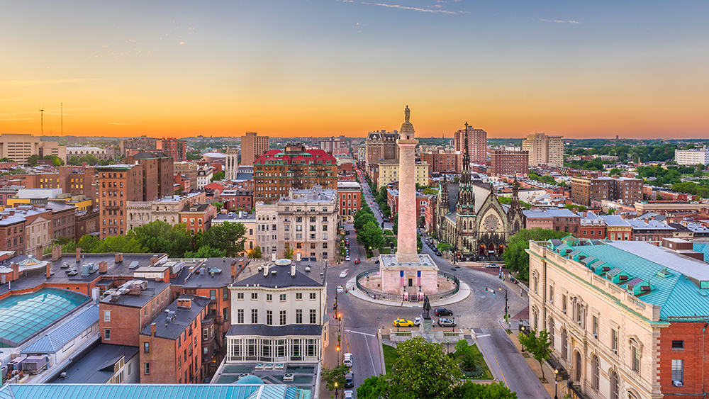 This image shows an aerial view of Mount Vernon place in downtown Baltimore at sunset.