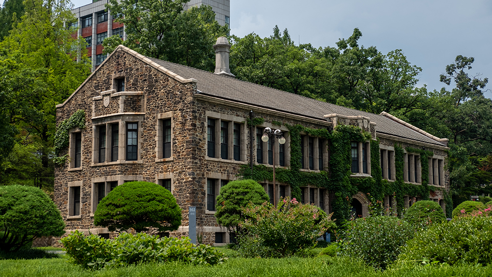 This photo shows an historic stone building on the campus of one of the oldest colleges in the US.