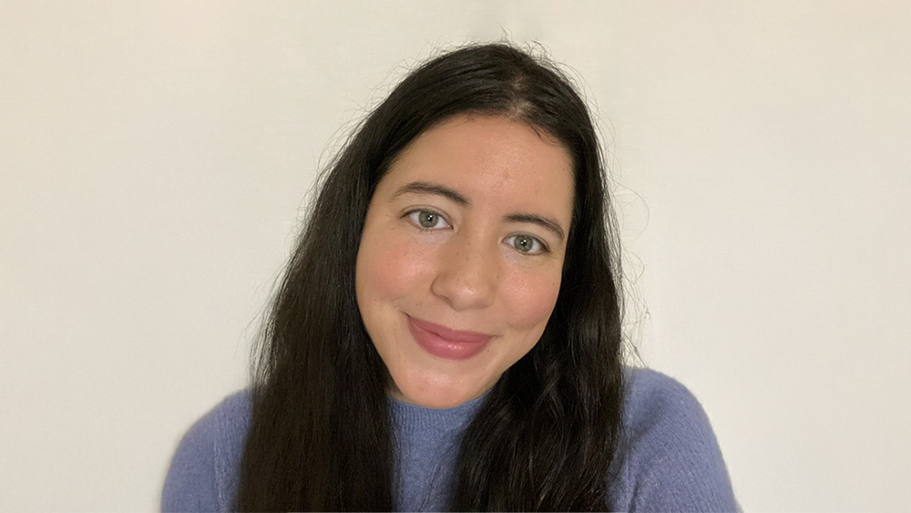 Lupe Arriola, student services advisor at American Collegiate LA at UCLA Extension, smiles for the camera