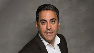 David Lecon, FIU Global First Year director, smiles for the camera