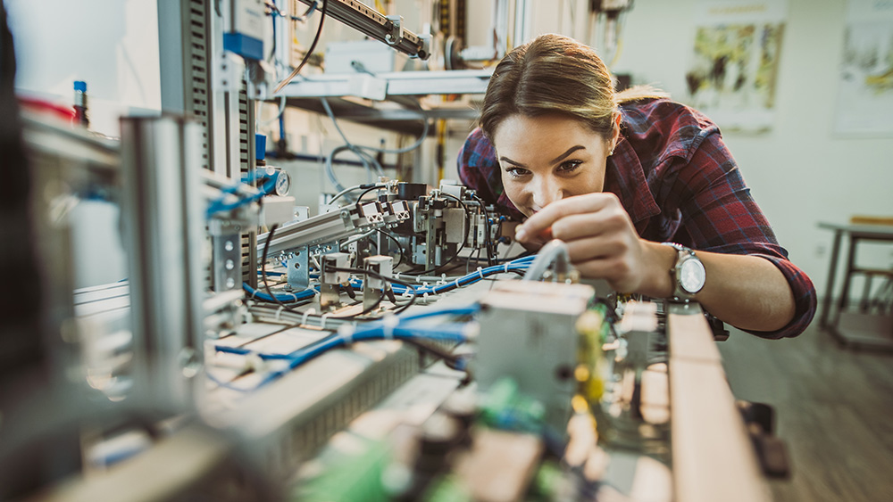 A student working on a machine