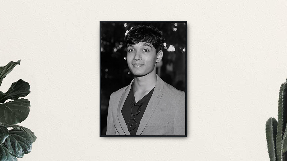 Sanchit, a UIC Global student from India who started a scholarship for international students, wears a blazer and smiles for the camera