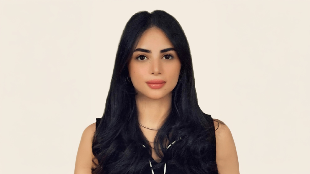 Nada, a Jordanian student from Kuwait studying construction management at Heriot-Watt University UK, smiles for the camera.