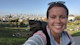 Shorelight Director of Partner Operations Caitlin Phillips Rivera smiles for the camera while on a backpacking trip