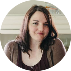 Writer Kate Knapp stands and smiles for the camera