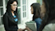 This photo shows a female international student in a suit jacket and glasses shaking hands with her interviewer and getting ready to find out her interview questions. Be prepared for answering interview questions with Shorelight.