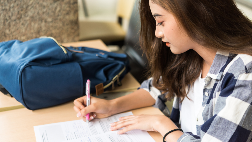 A female international student fills out a student loan application from MPower Financing.