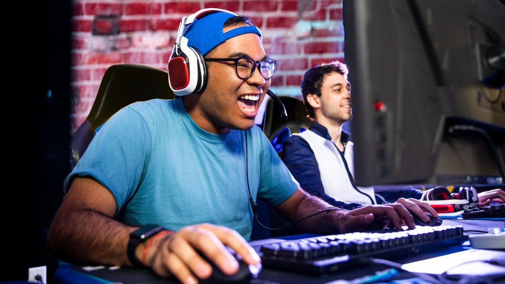 A male international student plays a video game during a gaming championship at UIC