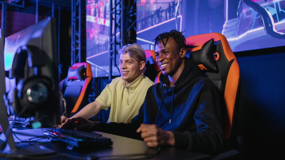 Two international students playing together at a gaming tournament