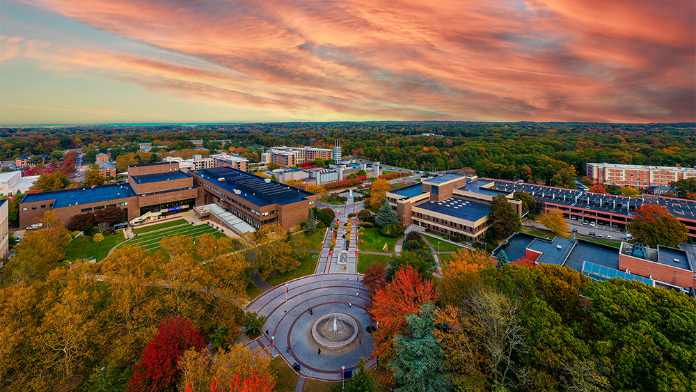 This photo shows an aerial view of Stony Brook University in New York state under a colorful sunset.