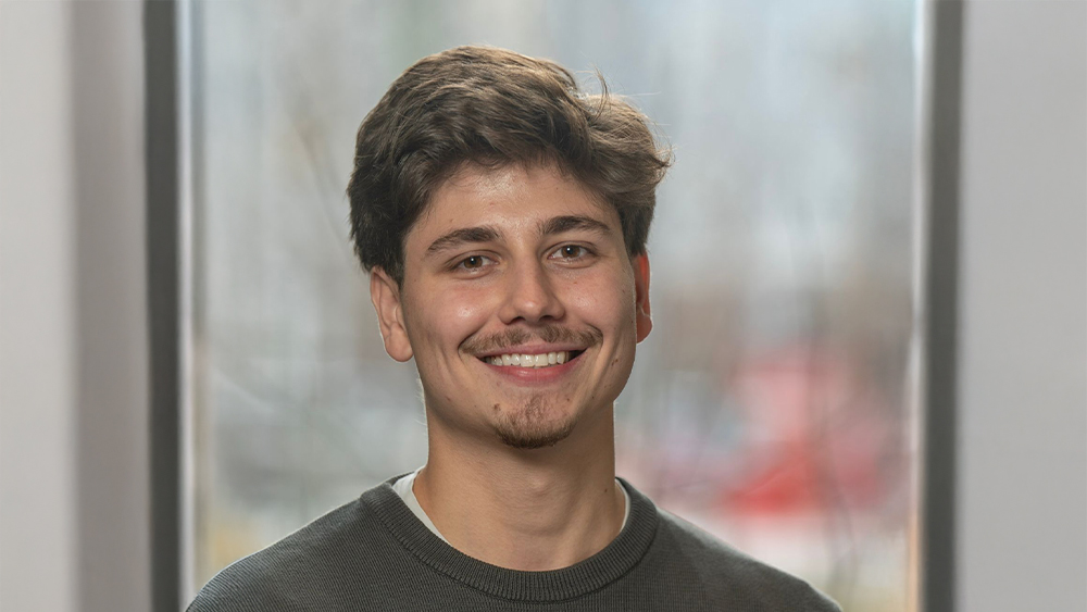 Nick, a Cleveland State University alum from Brazil, smiles for the camera.